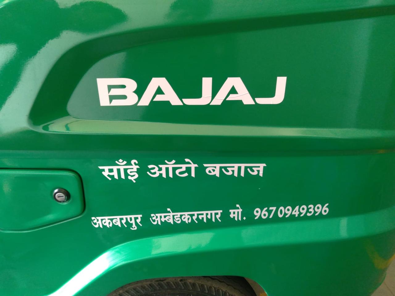 Bajaj sticker applied on vehicle — Saangi Auto Bajaj, Akbarpur (green)